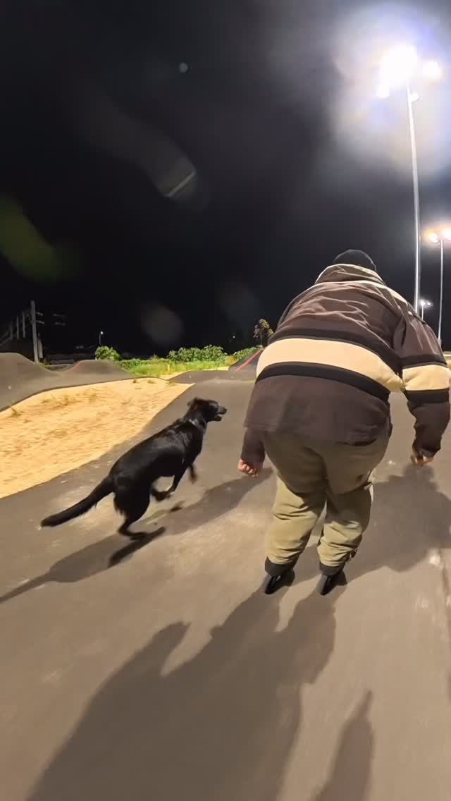 Rogue running beside a skater